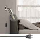 Lámpara Spostaluce con articulación metálica orientable