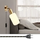 Lámpara Spostaluce con articulación metálica orientable