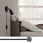 Lámpara Spostaluce con articulación metálica orientable
