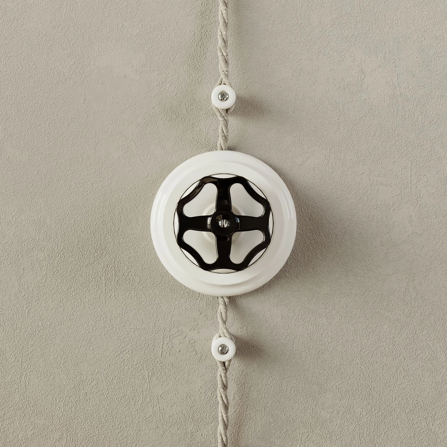 Interruptor de porcelana blanca con pomo y base.
